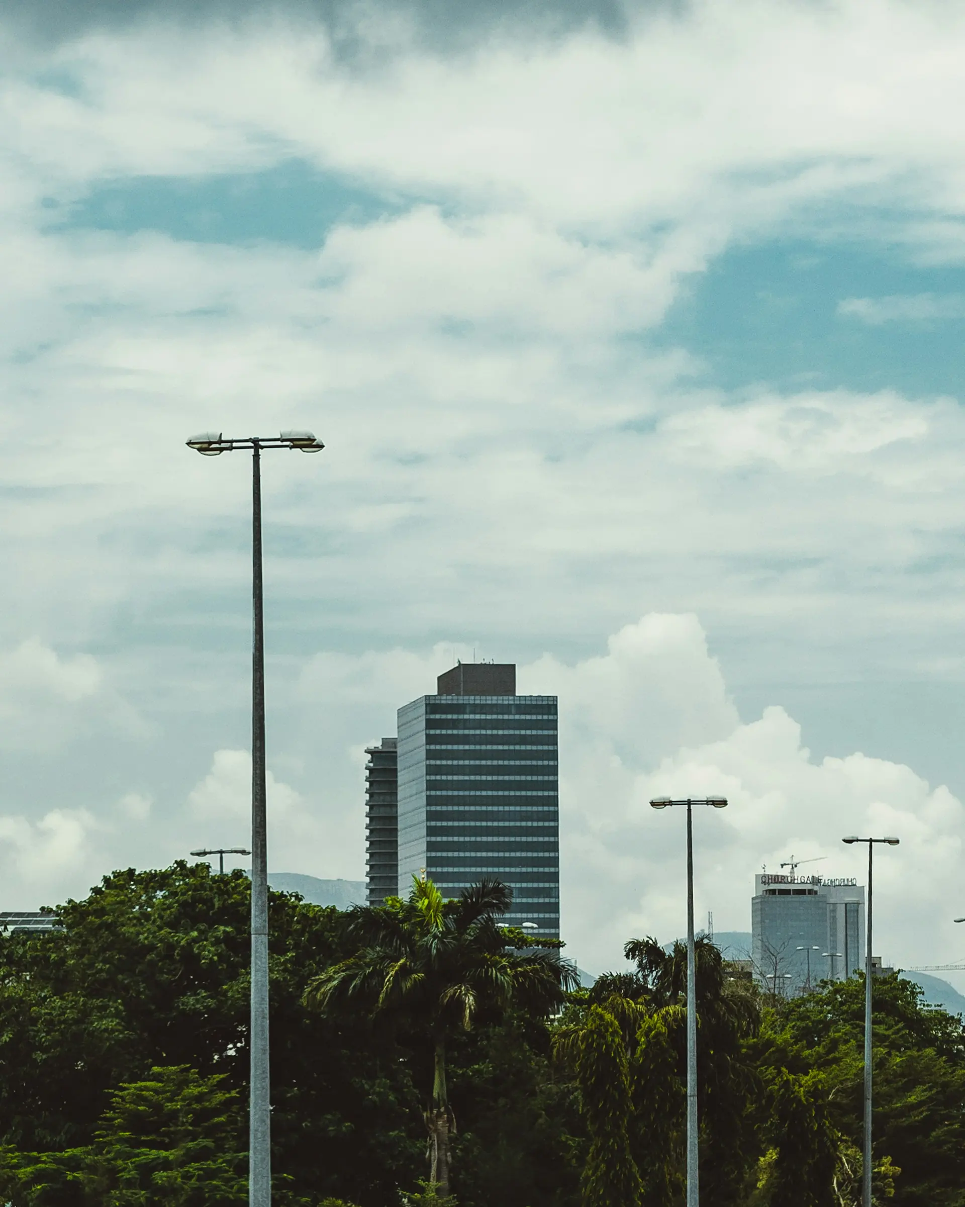 Abuja skyline with high-rise towers above the trees